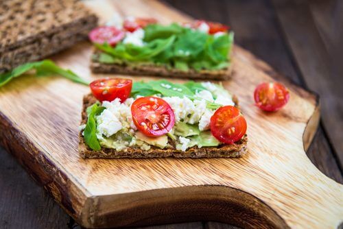 Seed crackers with cheese and tomatoes
