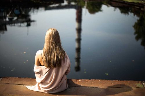 Woman getting sunlight to improve the quality of her rest