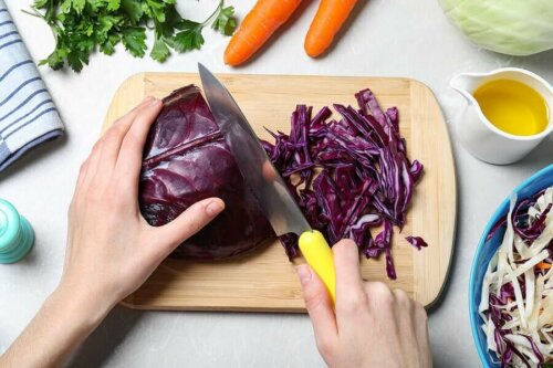 A person chopping red cabbage.