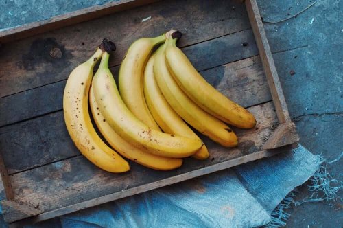 Bananas in a wooden box.