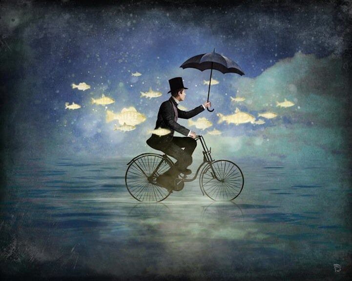 A man riding a bicycle on the water.