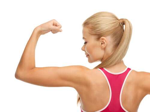 A woman flexing her arm