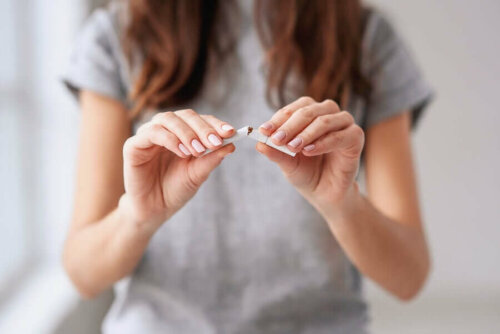 woman breaking a cigarette
