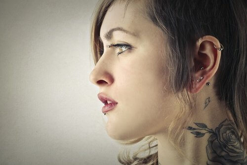Woman with piercings and tattoos