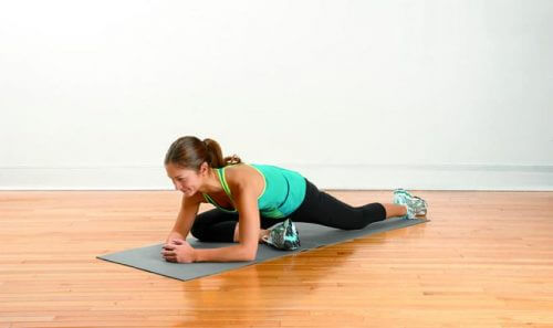 Woman doing stretching exercises for leg pain
