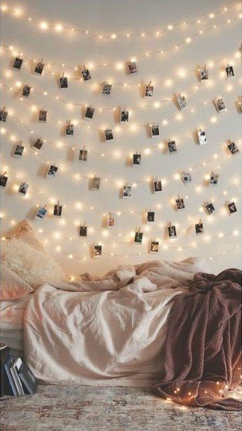 Photographs and lights on a wall