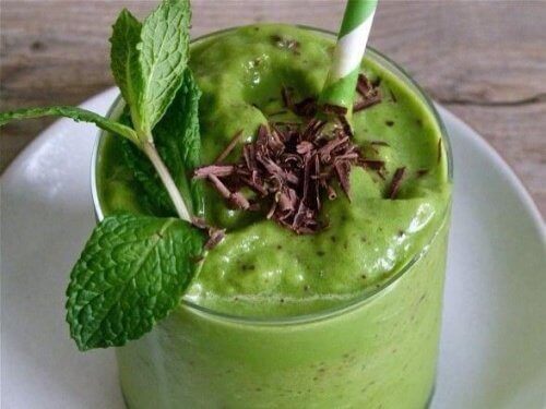 Avocado smoothie green with mint garnish avocado seed