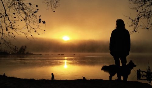 A man alone looking at the water.