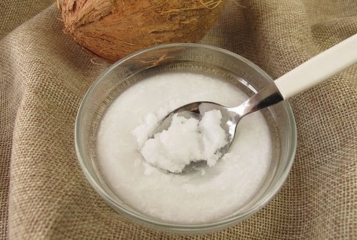 Bowl of solidified coconut oil white solid cleanse face with natural oils