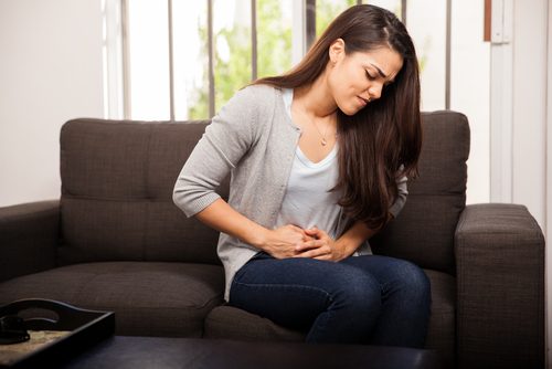 Woman with muscle discomfort