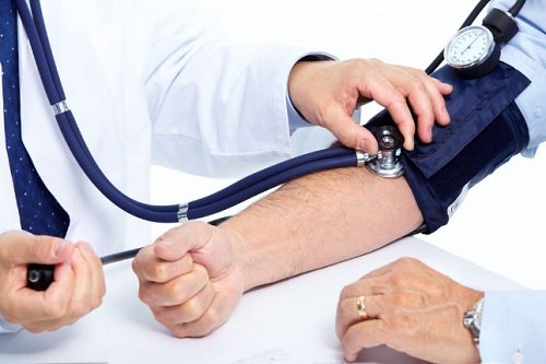 Taking someone's blood pressure.