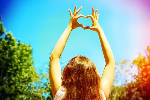 Woman making a heart shape with her hands