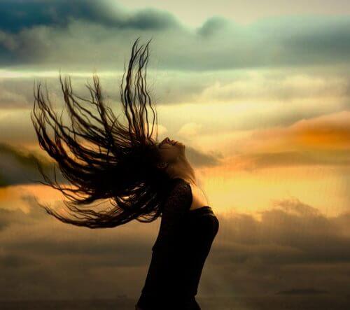 Woman shaking her head in the wind