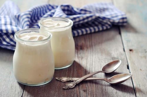 Two jars of natural yogurt