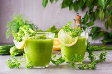 Two glasses of pineapple, strawberry, and cucumber smoothie.