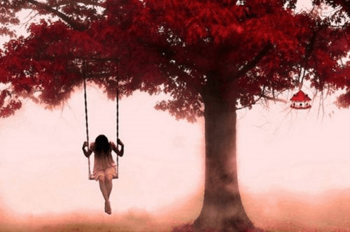 A lonely person on a swing.