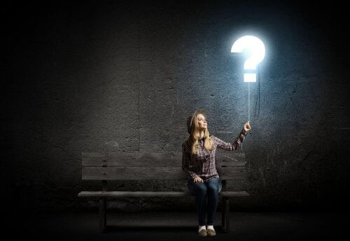 woman turning on a big light bulb, representing imagination