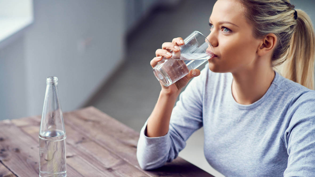 Woman drinking glass of water