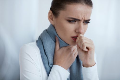 A woman with sore throat.