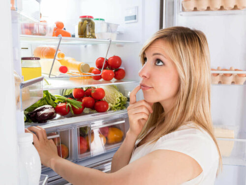 A woman thinking about what she wants to eat.