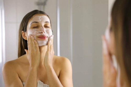 A woman trying to shrink her large pores by washing her face.