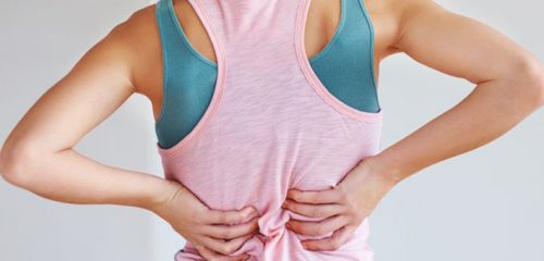 A woman with back pain.