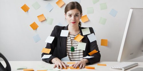 Woman with post-it notes everywhere.