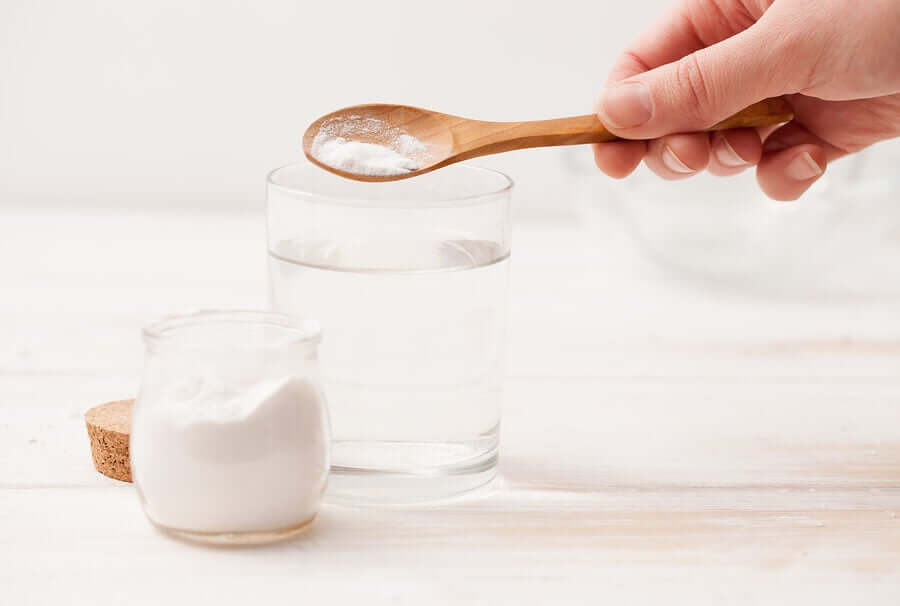 A person pouring baking soda.