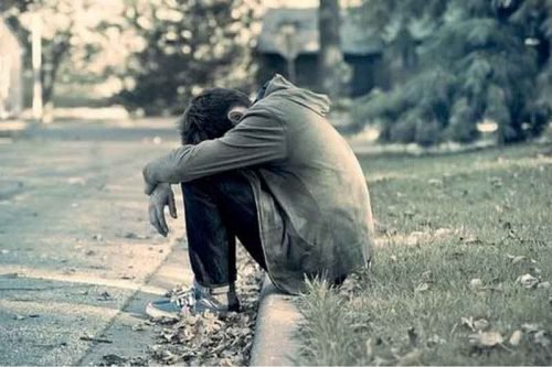 afraid boy on street