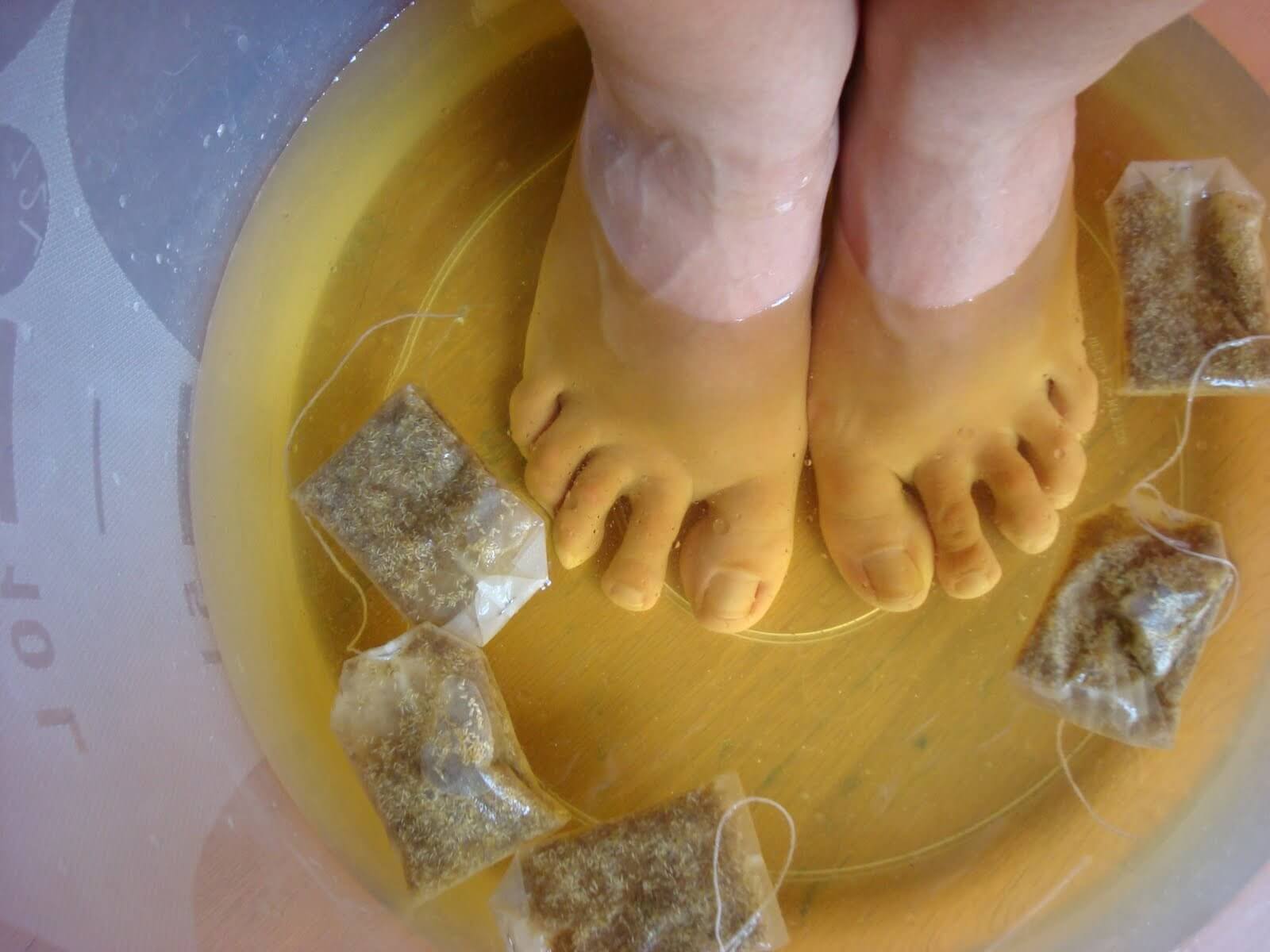 Feet getting soaked in tea.