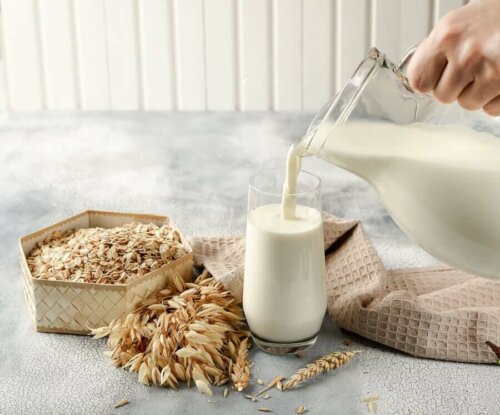 A person pouring milk into a glass.