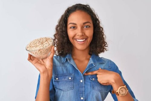 A woman holding a bowl of oatmeal.
