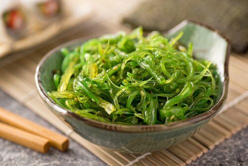 Bowl of kelp on a table.