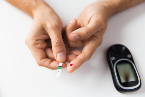 A diabetic woman measuring her blood sugar levels.