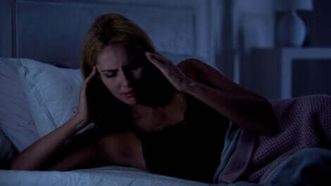 A woman with a nighttime headache.