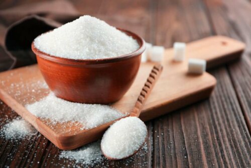 A bowl of sugar on a table.