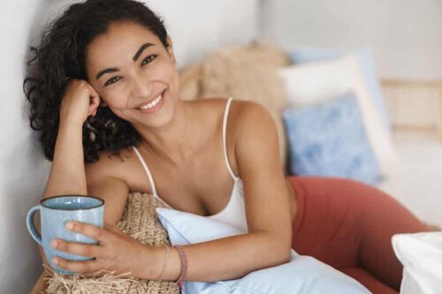A woman holding a cup.