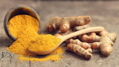Some ground turmeric in a bowl.