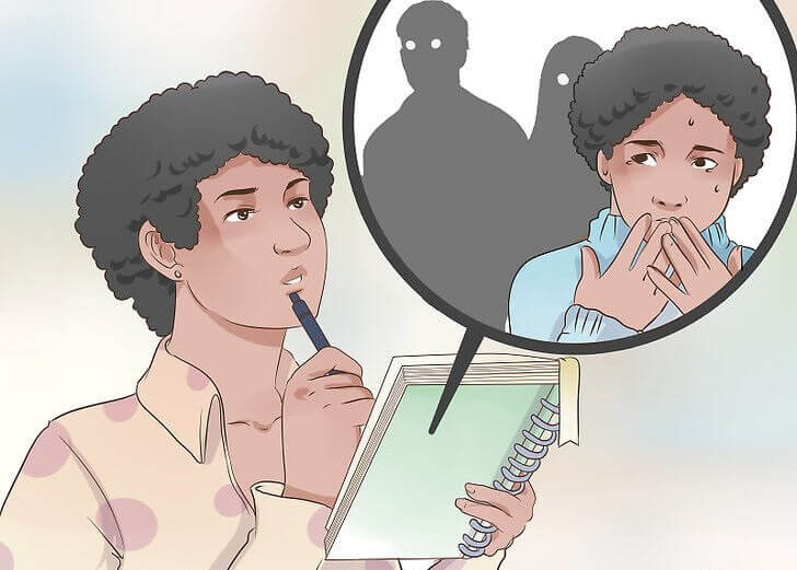 Person der sidder med en notesblok