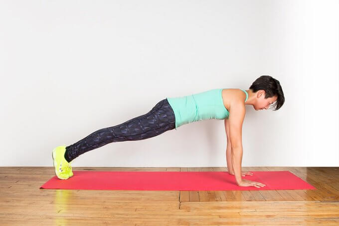 Legs lifts in a plank position