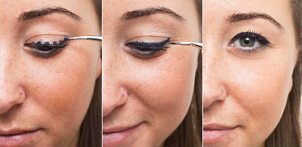Applying eyeliner