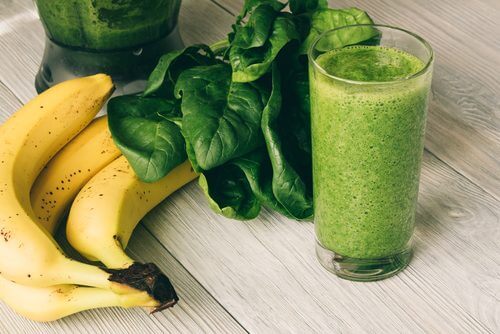 a green smoothie with leafy greens and bananas