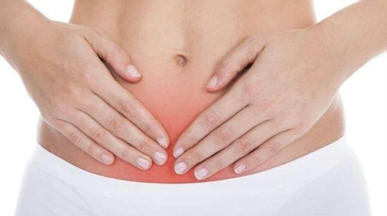 A woman with a belly ache.