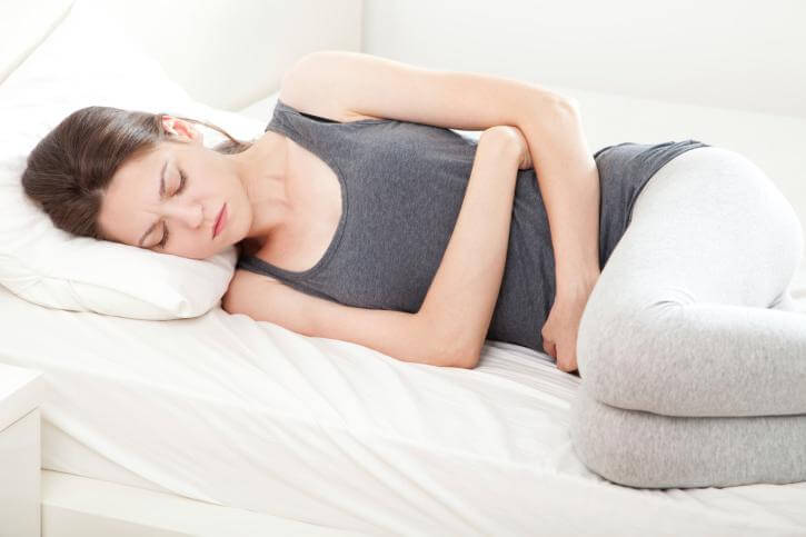 woman with pelvic pain and ovarian cancer symptoms