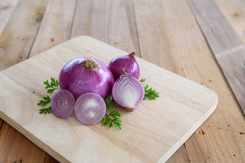 red onions on a cutting board