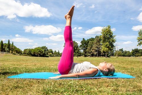 Benefits of elevating legs in park on a sunny day