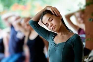 A woman exercising her cervical muscles.