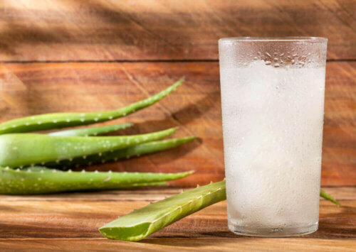 A cup of aloe vera mouthwash.