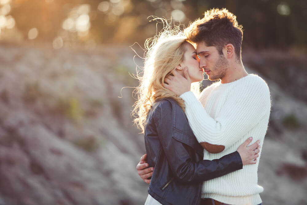 a happy couple holding each other close