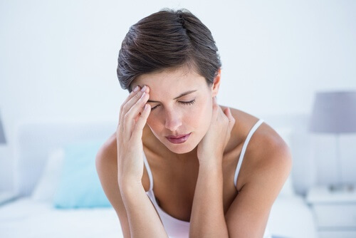 Woman suffering from a migraine